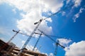 Construction cranes and unfinished building Royalty Free Stock Photo
