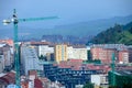Construction cranes with view of buildings behind