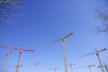 Construction cranes view over blue sky Royalty Free Stock Photo