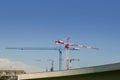 Construction cranes view over blue sky Royalty Free Stock Photo