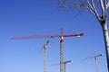 Construction cranes view over blue sky Royalty Free Stock Photo