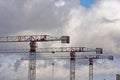Construction cranes work at a construction site Royalty Free Stock Photo
