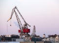 Construction cranes work in the port of Helsinki in winter