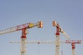 Construction cranes work at a construction site Royalty Free Stock Photo