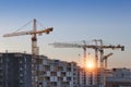 Construction cranes work in thef Helsinki in winter Royalty Free Stock Photo