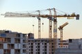 Construction cranes work in thef Helsinki in winter