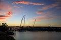 Construction cranes working on the Arkansas River Bridge