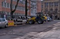 road construction work with heavy equipment lifting a concrete tube element in Bonn, Germany