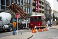 Construction crewman stopping traffic while laying cable