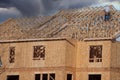 Construction crew working on the roof sheathing of a new building Royalty Free Stock Photo