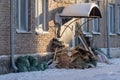 Construction debris in bags near the front door of an old apartment building Royalty Free Stock Photo