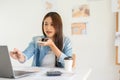 Construction design concept, Female architect talking on smartphone during sketching house plan Royalty Free Stock Photo