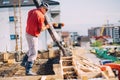 Construction details - worker laying cement or concrete with automatic pump at house construction Royalty Free Stock Photo