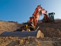 Construction digger in a sandpit Royalty Free Stock Photo