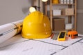 Construction drawings and different tools on table in office Royalty Free Stock Photo