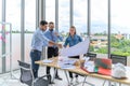 Construction engineer and architect check plan working with the blueprint on office worker conference site. Engineers team meeting Royalty Free Stock Photo