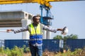 Construction engineer directing work at infrastructure site, industrial supervisor coordinating construction project outdoors, Royalty Free Stock Photo