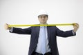 Construction engineer holds measuring tape looks at camera Focus on architect Royalty Free Stock Photo