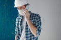 Construction engineer with protective face mask talking on mobile phone Royalty Free Stock Photo