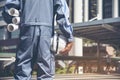 Construction engineer in Safety Suit Trust Team Holding White Yellow Safety hard hat Security Equipment on Construction Site. Royalty Free Stock Photo