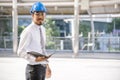 Construction engineer in Safety Suit Trust Team Holding White Yellow Safety hard hat Security Equipment on Construction Site. Royalty Free Stock Photo