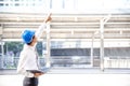 Construction engineer in Safety Suit Trust Team Holding White Yellow Safety hard hat Security Equipment on Construction Site. Royalty Free Stock Photo