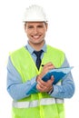 Construction engineer writing on notepad Royalty Free Stock Photo
