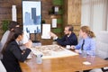 Construction engineers in business suit in a meeting with team of architects Royalty Free Stock Photo