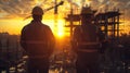 Construction Engineers Overlooking Site at Sunset Silhouette. Royalty Free Stock Photo