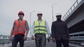 Construction engineers walking on highway ramp