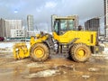 Construction equipment on site. building houses and laying roads. bright, yellow excavator for digging holes and laying plumbing Royalty Free Stock Photo