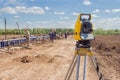 Construction equipment. Surveyors equipment theodolite on the construction site. Monitoring the progress of construction work