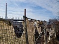 construction fence with torn fabric that protects the surroundings