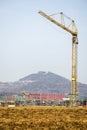 Construction field in winter with crane Royalty Free Stock Photo