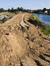 Construction of a floodbank or levee along a river