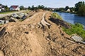 Construction of a floodbank or levee along a river