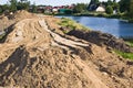 Construction of a floodbank or levee along a river