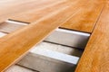 Construction floor installation wooden work flooring wood plank. Repair floor covering. Repair house deck floor