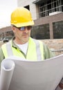 Construction Foreman looking at Blueprints