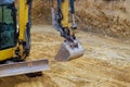Construction foundation with excavator on loader digs of underground Royalty Free Stock Photo