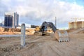 Construction of foundation excavator works in sand pit. Groundworks, site levelling, construction of reinforced ground beams on