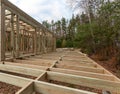 Construction of a frame house in the forest. Autumn