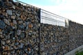 construction of a gabion retaining wall, as part of the fencing home coarser Royalty Free Stock Photo