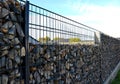 construction of a gabion retaining wall, as part of the fencing home coarser Royalty Free Stock Photo