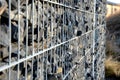 Construction of a gabion retaining wall, as part of the fencing home coarser gravel filled poured between two wire slabs. stones p