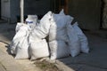 Construction garbage after apartment repair. Pile of construction waste near a multistorey residential building Royalty Free Stock Photo