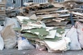 Construction garbage is piled up at site after building repair. Trash heap Royalty Free Stock Photo