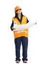 A construction girl on a green background, full-length, with drawings Royalty Free Stock Photo