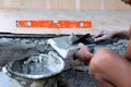 Construction hand holding trowel plastering concrete Royalty Free Stock Photo
