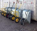 Construction handcars leaning against a wooden wall